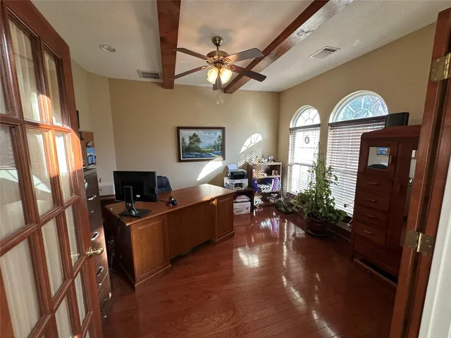a view of a livingroom with furniture hardwood floor and a view of living room