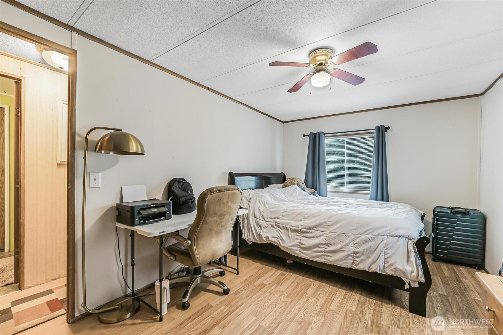 980 South Falcon Road Camano Island, WA 98282 - Photo 20 of 30 a bedroom with a bed and a chandelier
