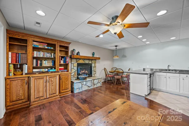 a kitchen with stainless steel appliances granite countertop a refrigerator a sink and a stove