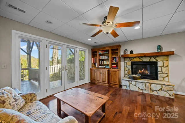 a bathroom with a granite countertop toilet a sink and a mirror