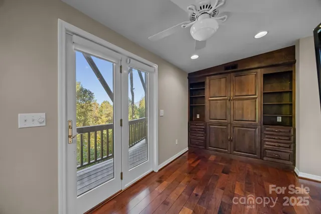 a bed room with a bed and a chandelier