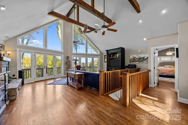 a living room with lots of furniture and a flat screen tv
