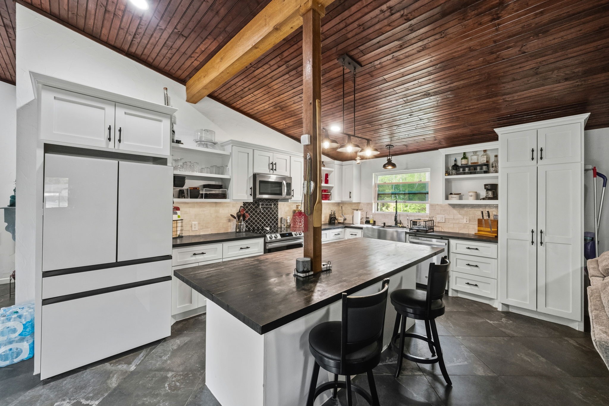 625-635 Gibson Road Livingston, TX 77351 - Photo 8 of 48 Kitchen area with butcher block counters, stainless appliances, custom cabinets and custom fridge which conveys with purchase.