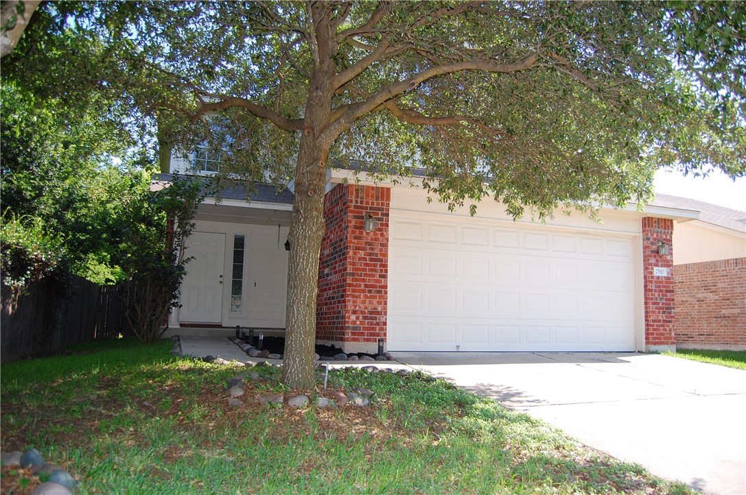 Tree shaded front yard.