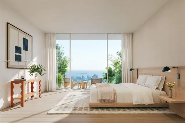 a bed sitting in a bedroom next to a window