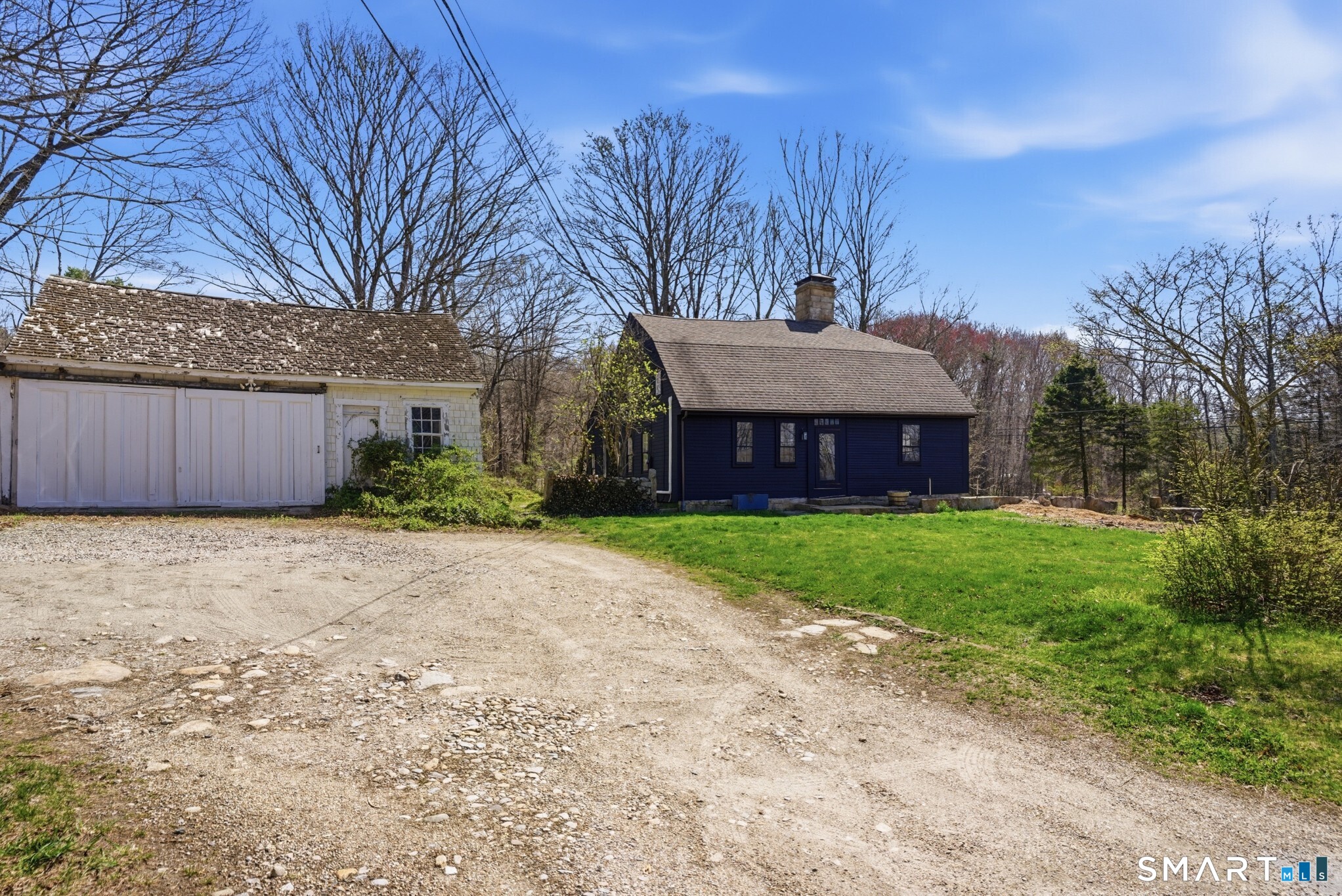604 Pendleton Hill Road North Stonington, CT 06359 - Photo 35 of 39 a front view of a house with a yard and garage