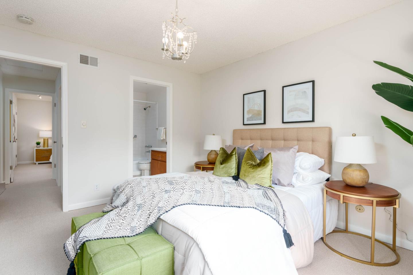 1021 Oddstad Boulevard Pacifica, CA 94044 - Photo 12 of 15 a bedroom with a bed and chandelier