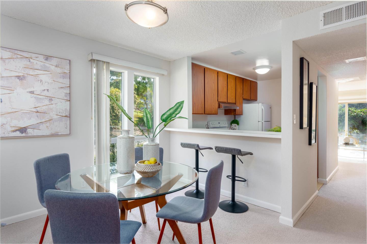1021 Oddstad Boulevard Pacifica, CA 94044 - Photo 2 of 15 a view of a dining room with furniture and a potted plant