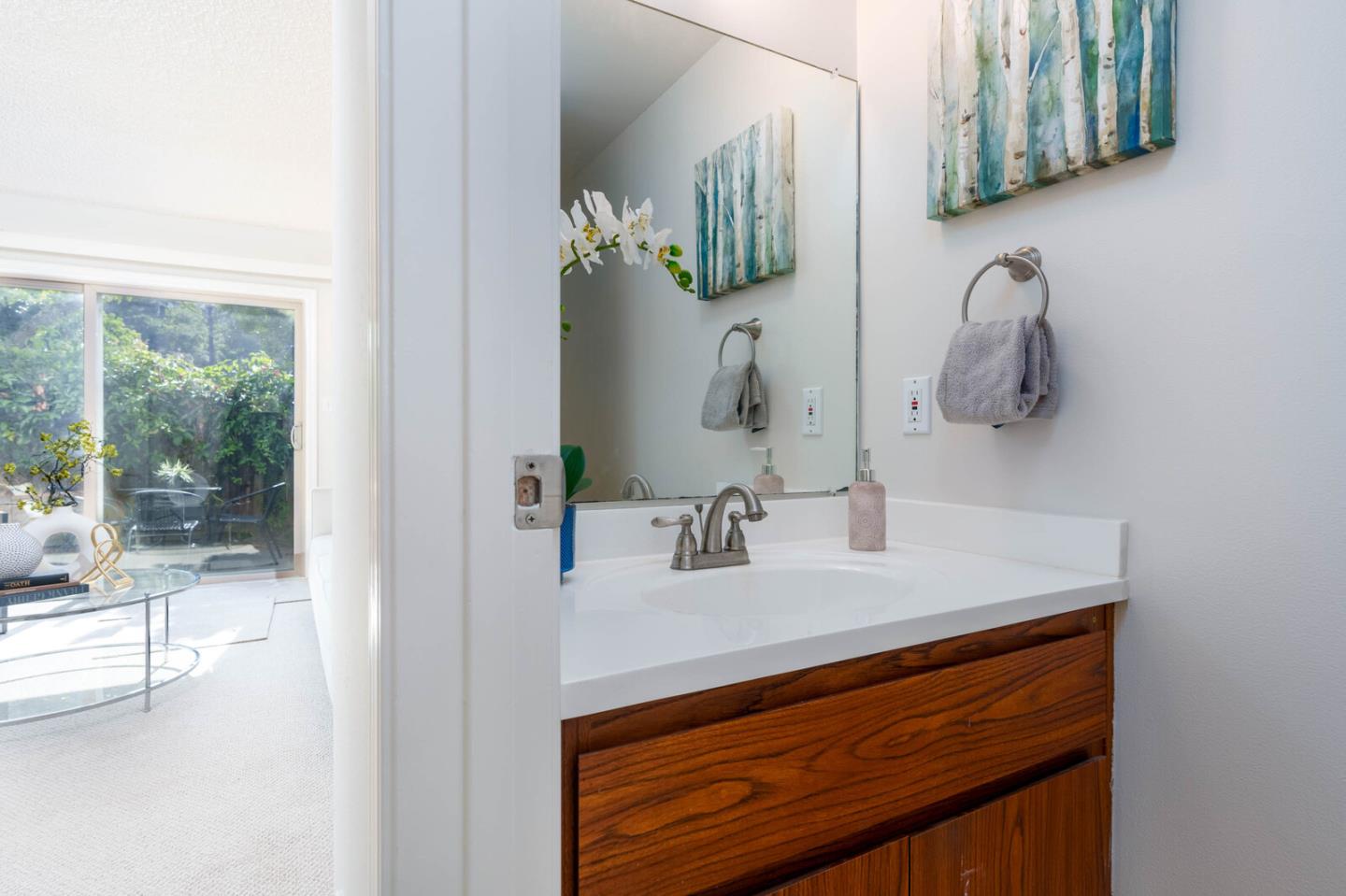 1021 Oddstad Boulevard Pacifica, CA 94044 - Photo 6 of 15 a bathroom with a sink and a mirror