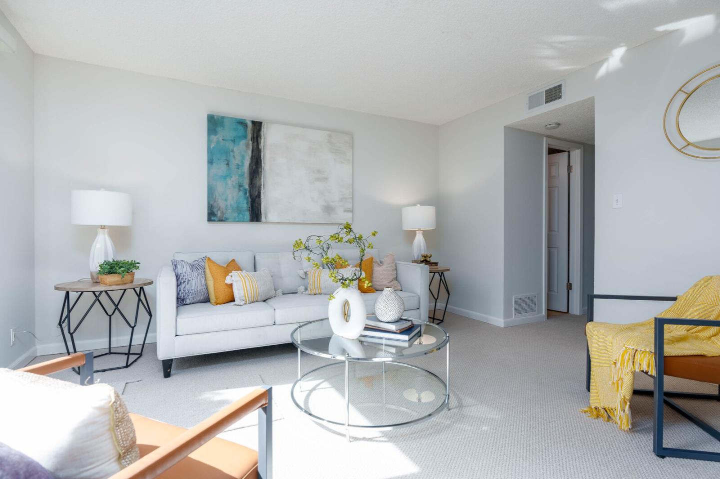 1021 Oddstad Boulevard Pacifica, CA 94044 - Photo 8 of 15 a living room with furniture and a chandelier