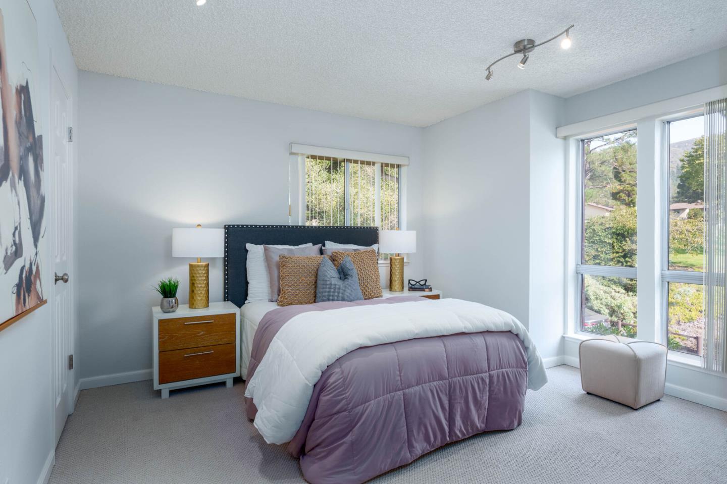 1021 Oddstad Boulevard Pacifica, CA 94044 - Photo 9 of 15 a bedroom with a bed and large window