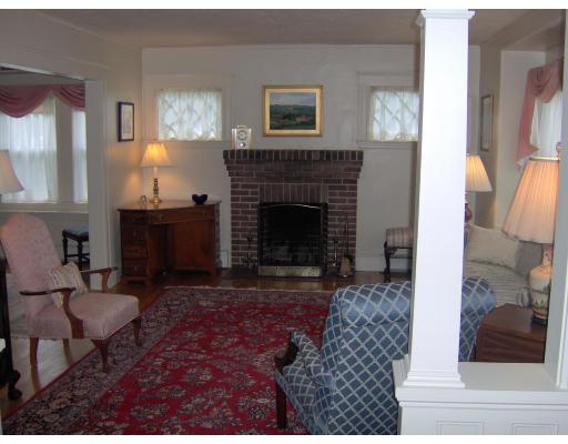 335 Reedsdale Road Milton, MA 02186 - Photo 3 of 11 a living room with furniture and a fireplace