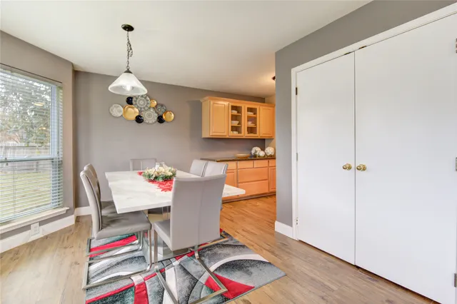 a kitchen with stainless steel appliances kitchen island granite countertop a sink and cabinets