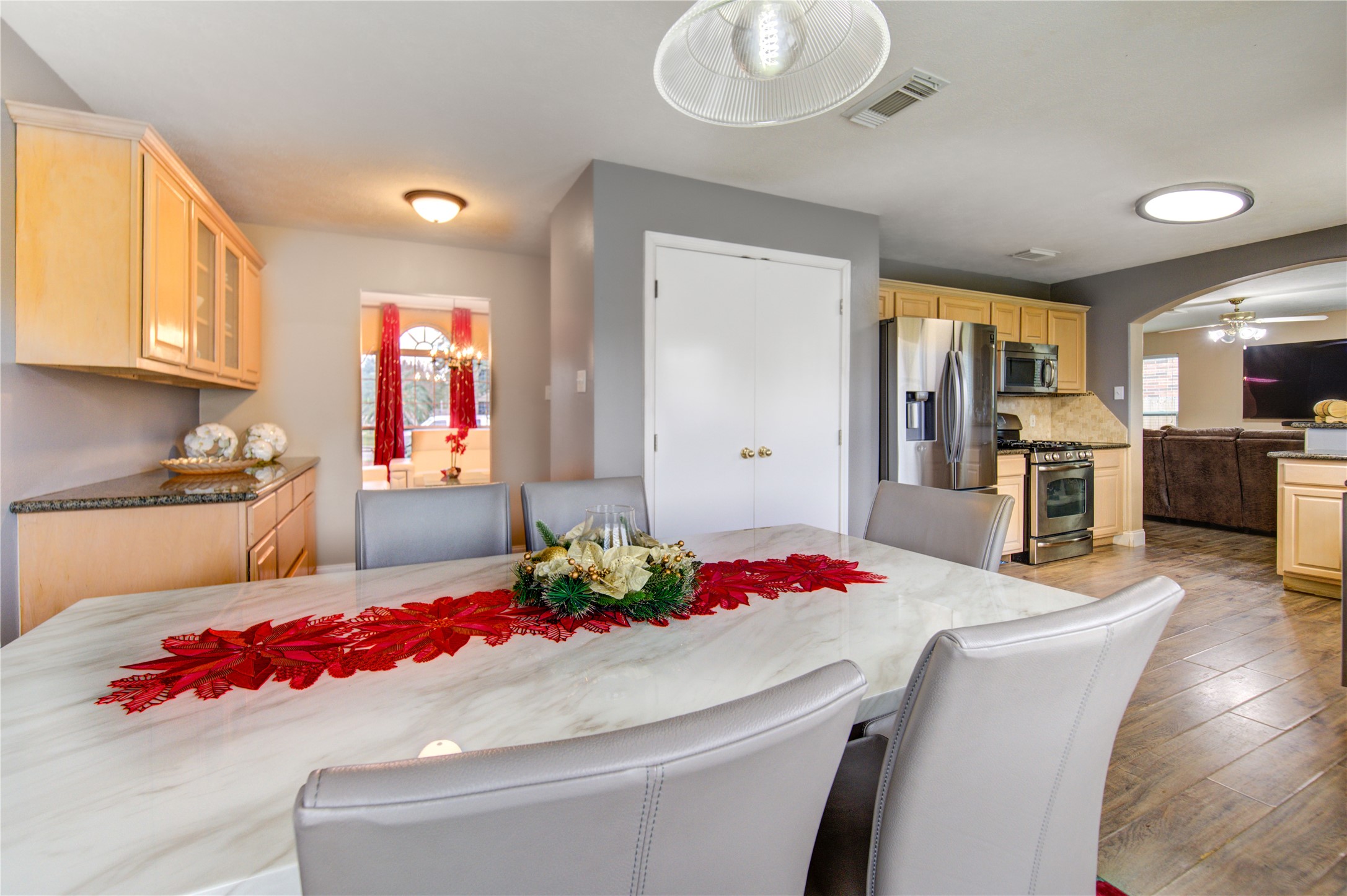 14902 Englebrook Drive Houston, TX 77095 - Photo 14 of 50 a kitchen with stainless steel appliances kitchen island granite countertop a sink and cabinets