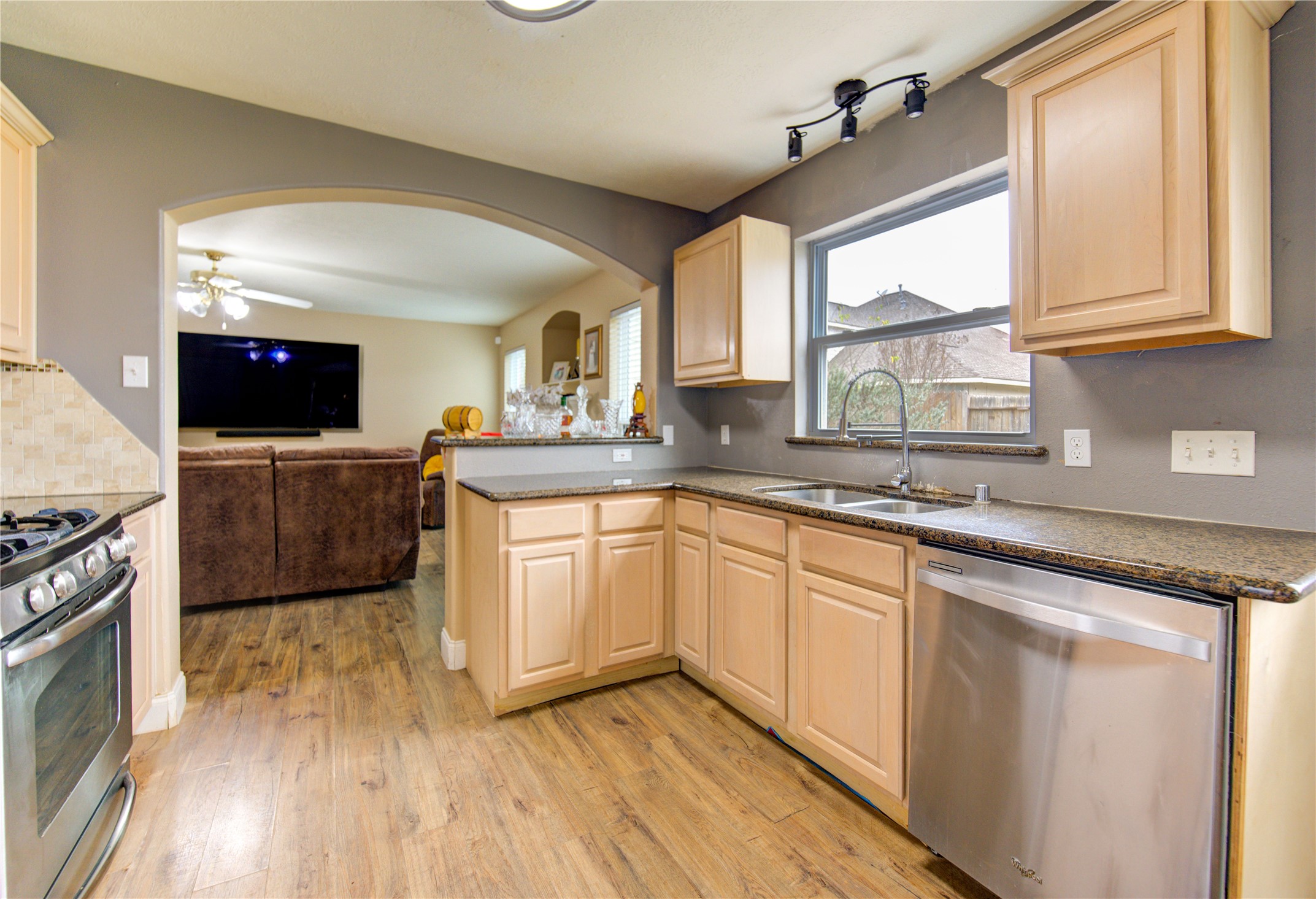 14902 Englebrook Drive Houston, TX 77095 - Photo 25 of 50 a kitchen with stainless steel appliances granite countertop a stove a sink and a microwave