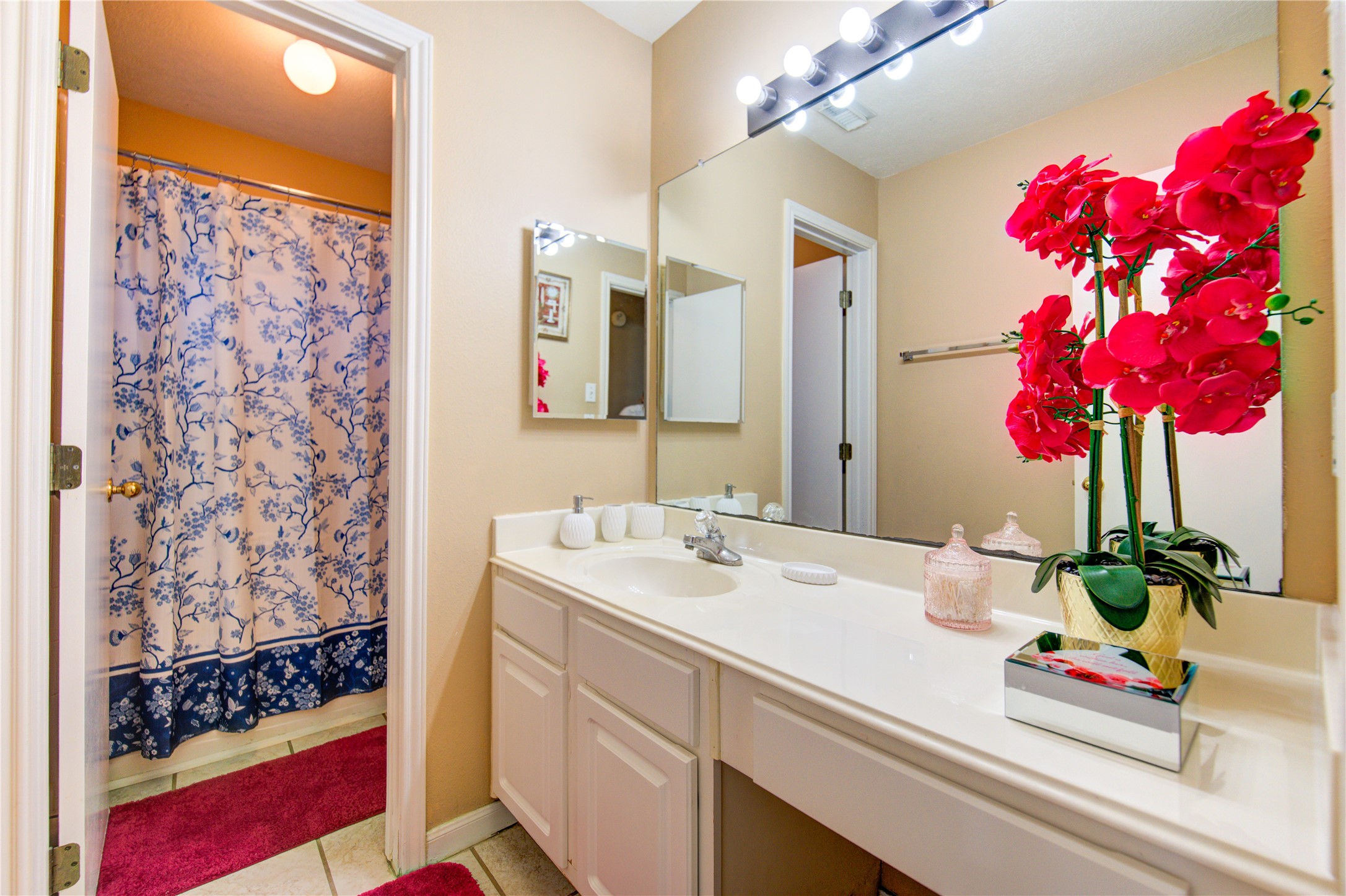 14902 Englebrook Drive Houston, TX 77095 - Photo 27 of 50 a bathroom with a sink mirror and vanity
