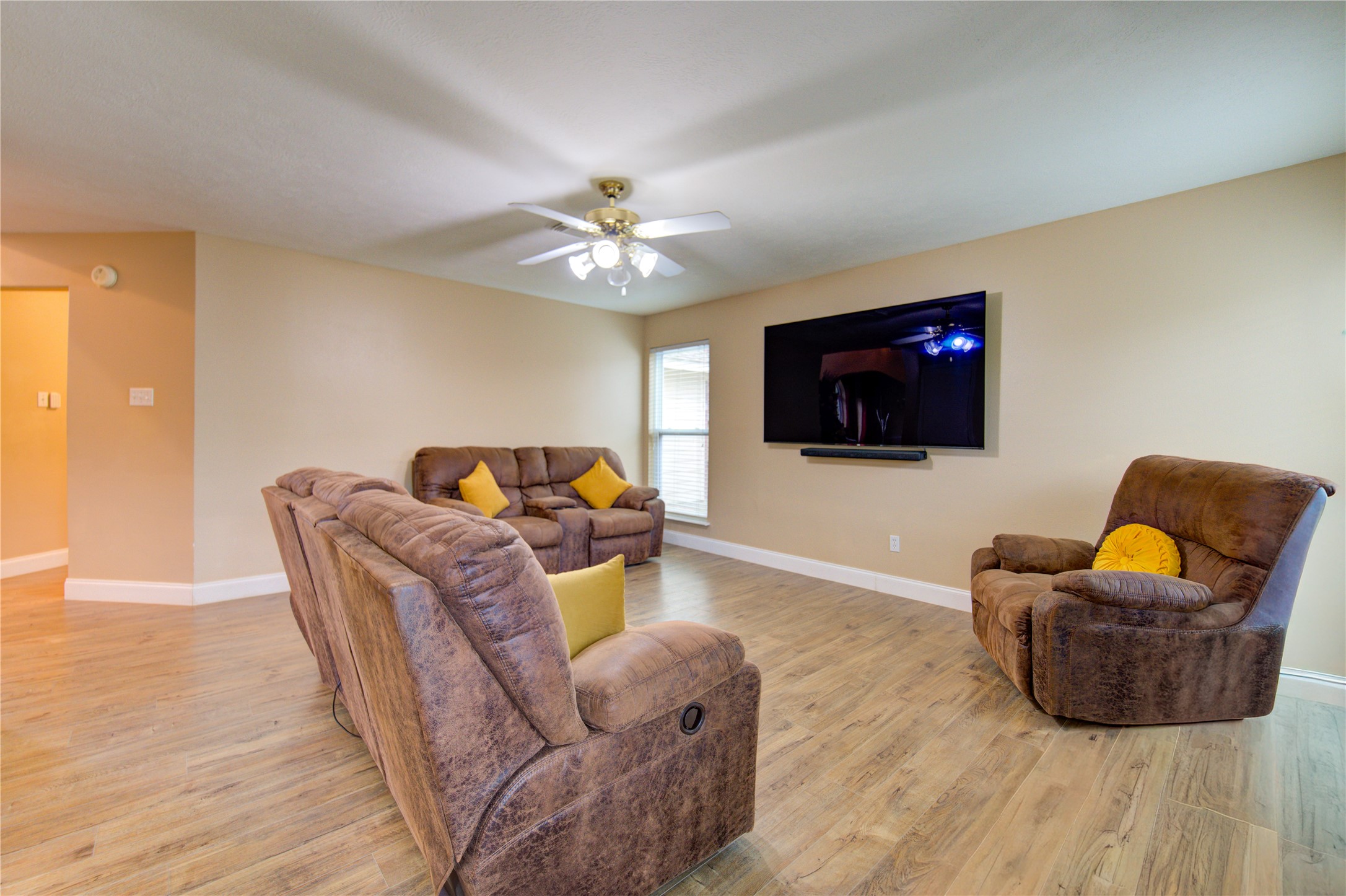 14902 Englebrook Drive Houston, TX 77095 - Photo 29 of 50 a living room with furniture a flat screen tv and kitchen view
