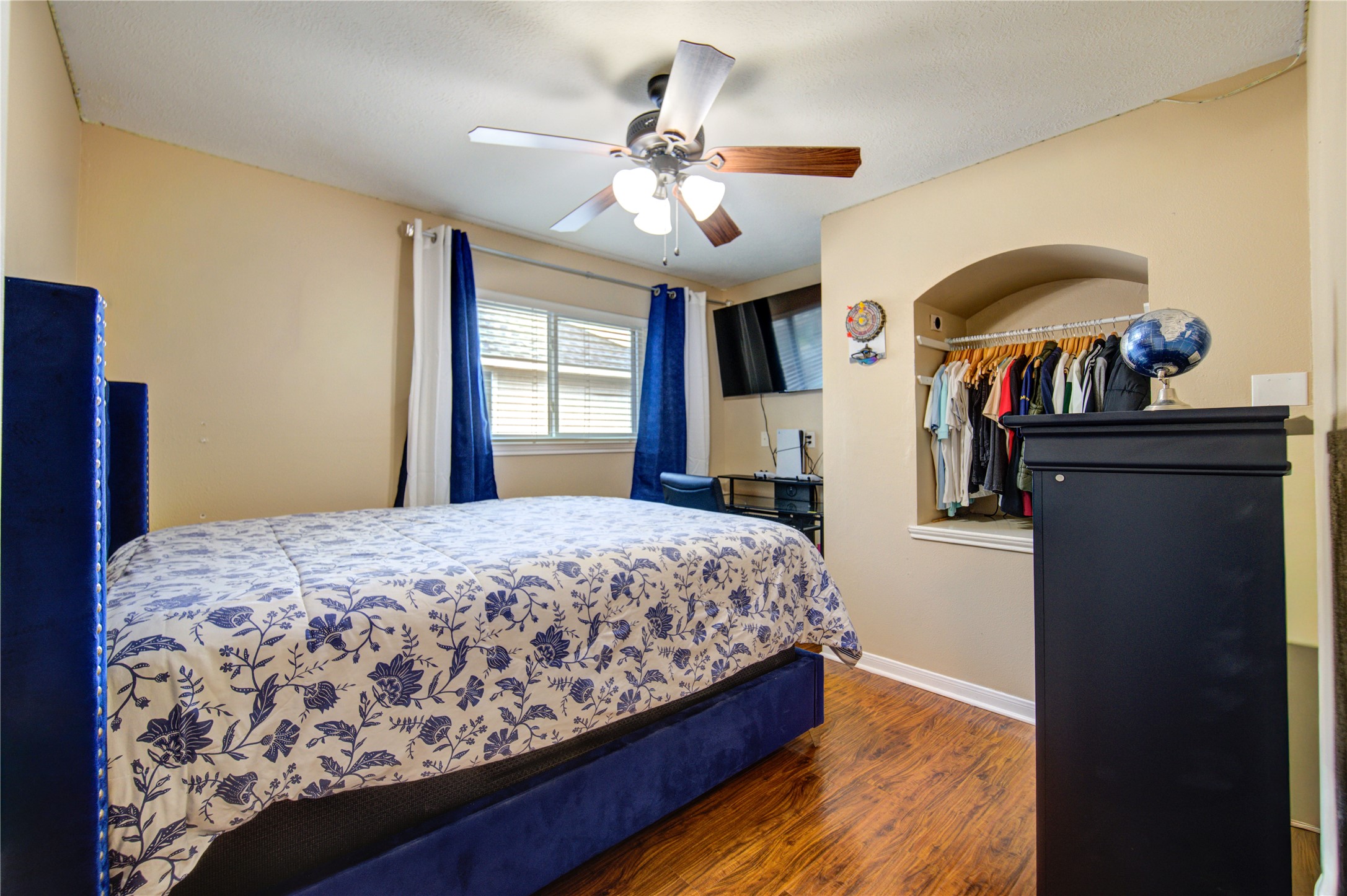 14902 Englebrook Drive Houston, TX 77095 - Photo 31 of 50 a bedroom with a bed and a chandelier