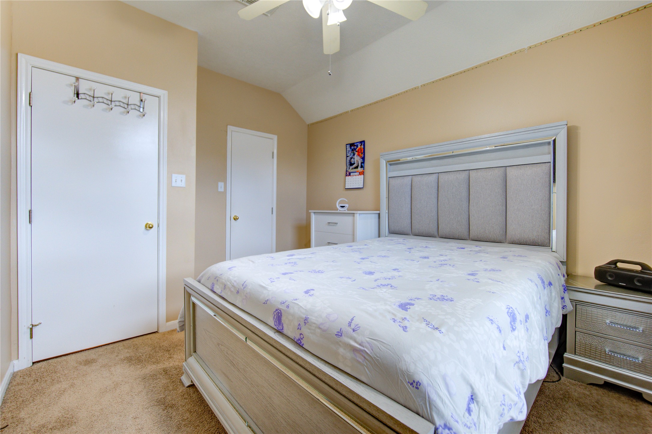 14902 Englebrook Drive Houston, TX 77095 - Photo 32 of 50 a bedroom with a bed and a chandelier