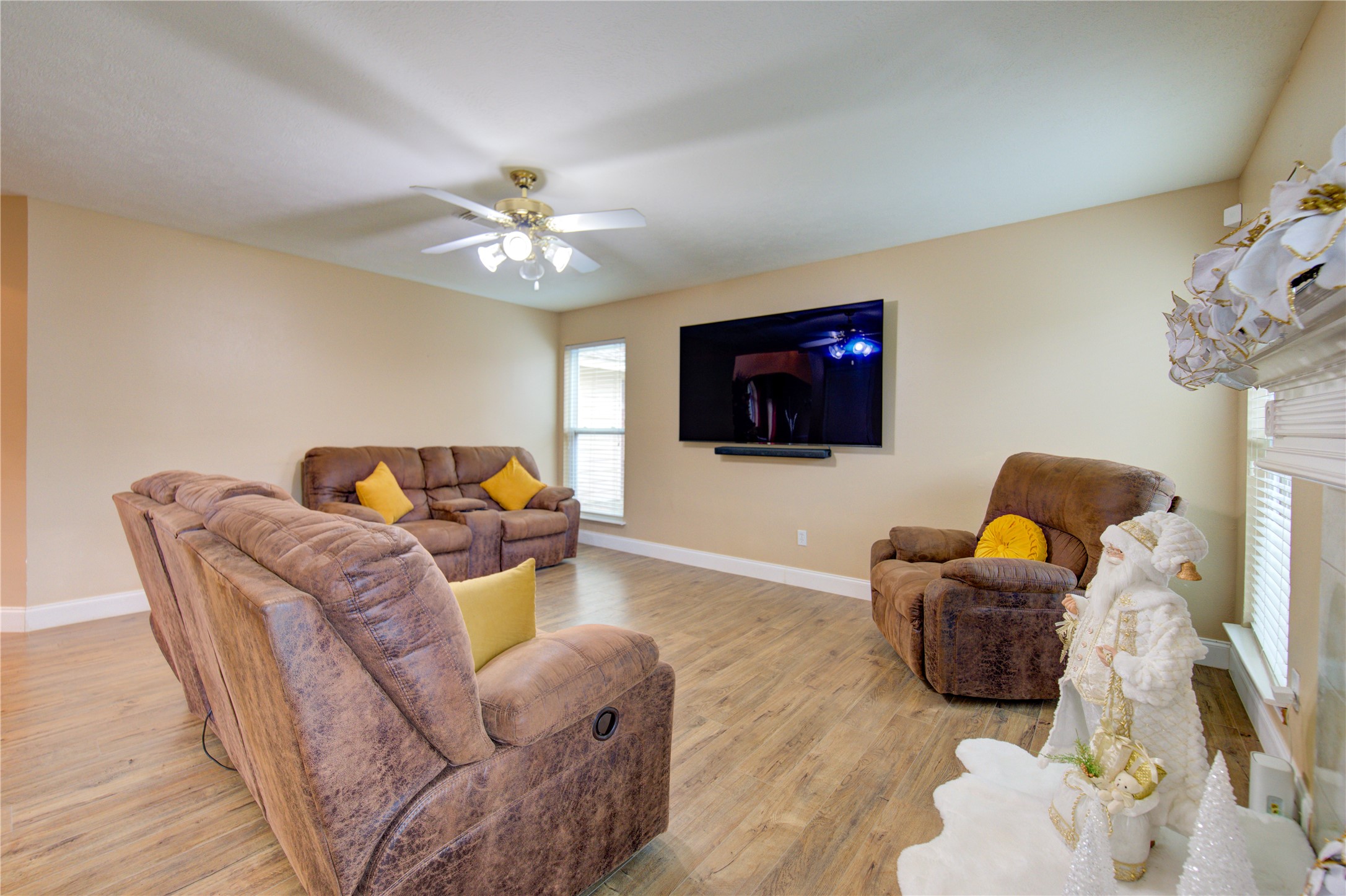 14902 Englebrook Drive Houston, TX 77095 - Photo 34 of 50 a living room with furniture a flat screen tv and kitchen view