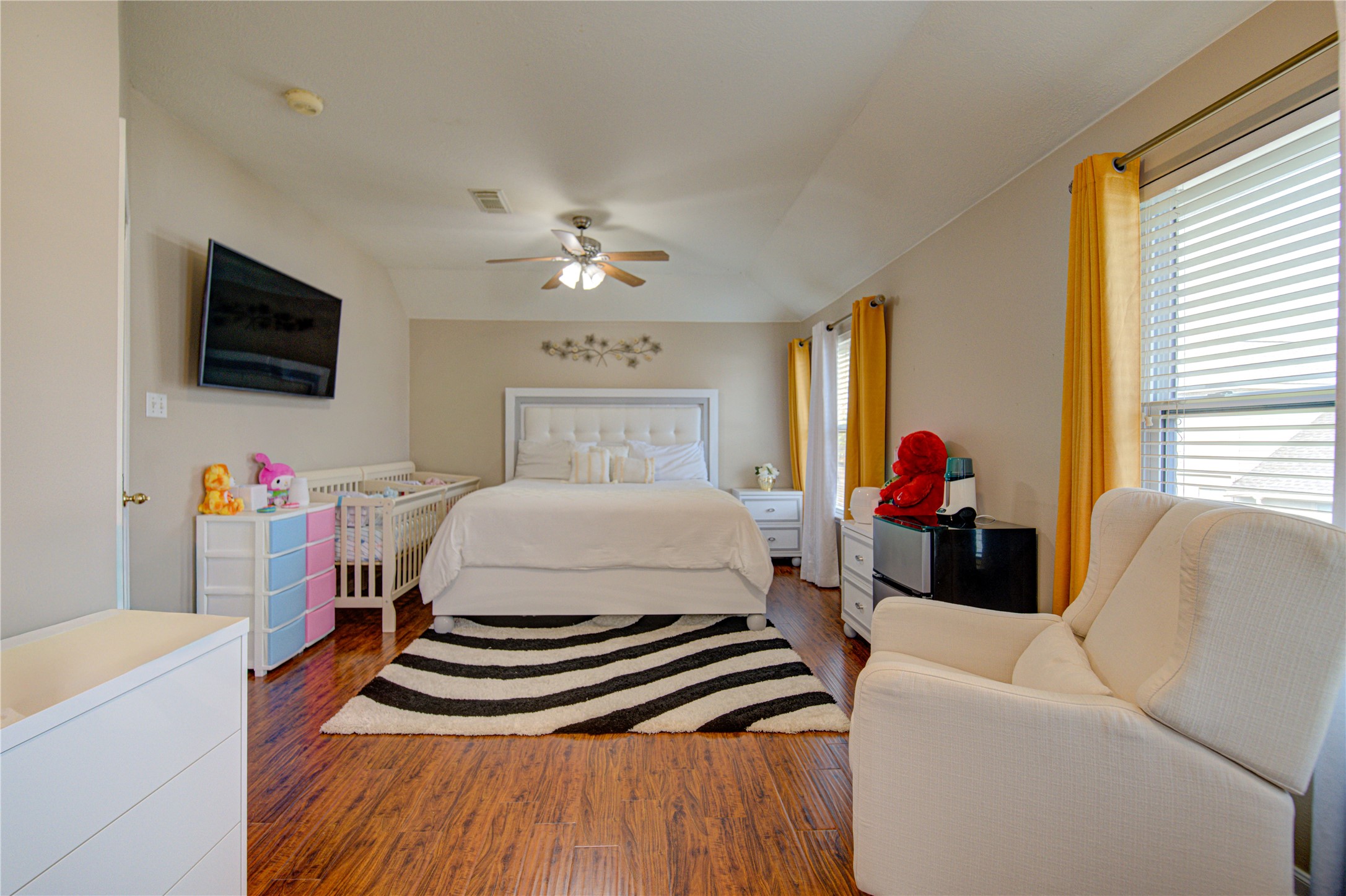 14902 Englebrook Drive Houston, TX 77095 - Photo 37 of 50 a bedroom with a bed a flat screen tv and dresser