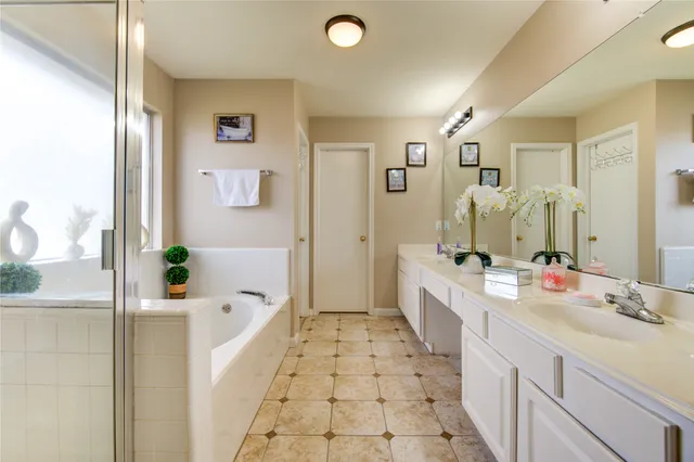 a view of bathroom with dual sinks