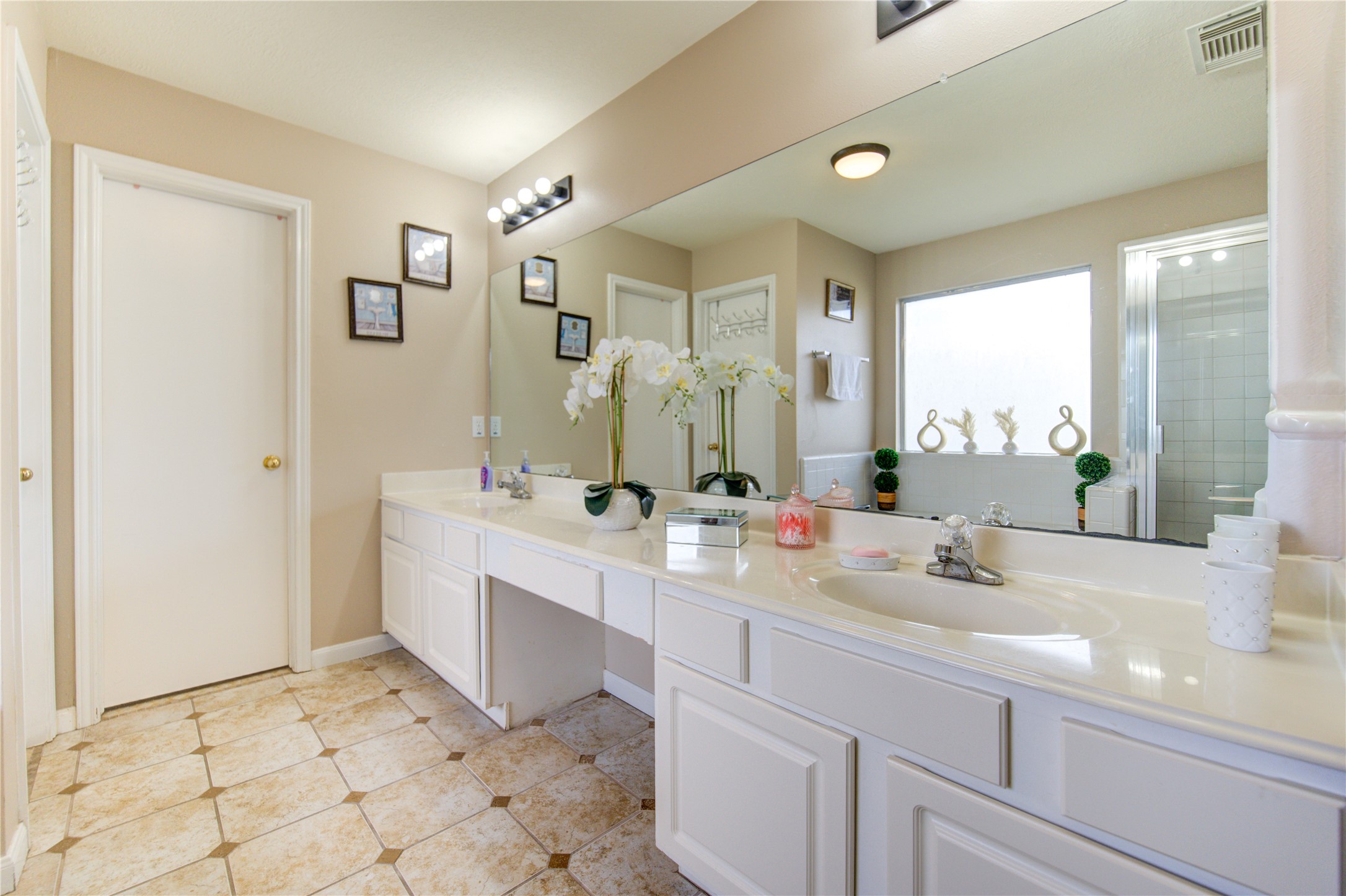 14902 Englebrook Drive Houston, TX 77095 - Photo 39 of 50 a view of bathroom with dual sinks