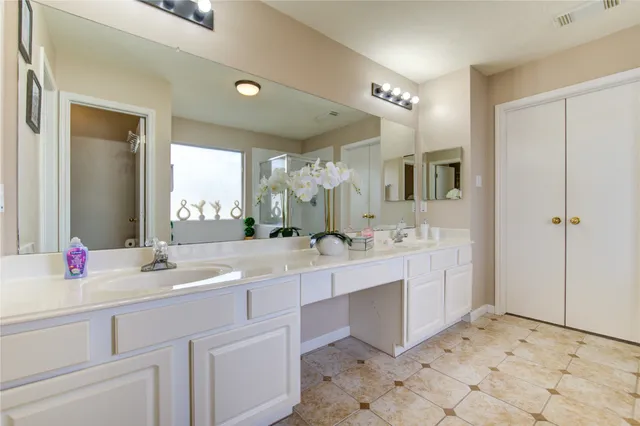 a white bath tub sitting next to a shower
