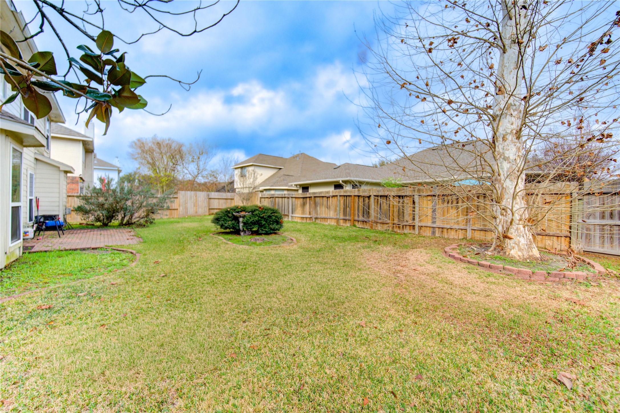 14902 Englebrook Drive Houston, TX 77095 - Photo 48 of 50 a view of a house with a large tree and a yard