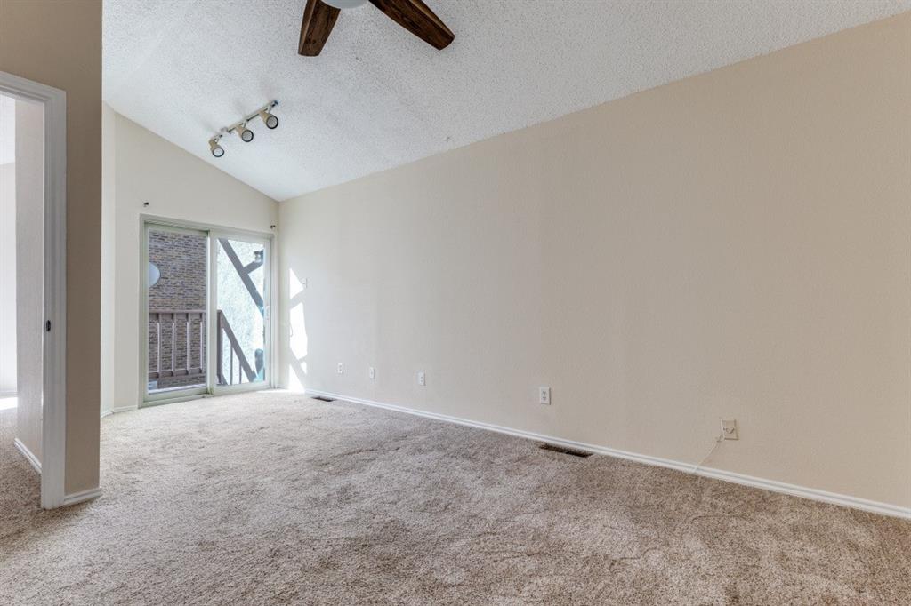 14151 Montfort Drive, Unit 345 Dallas, TX 75254 - Photo 22 of 31 an empty room with fan and windows