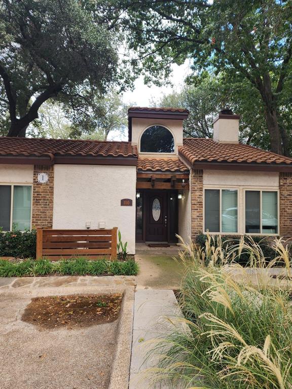 14151 Montfort Drive, Unit 345 Dallas, TX 75254 - Photo 24 of 31 a front view of a house with garden