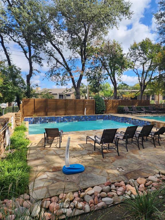 14151 Montfort Drive, Unit 345 Dallas, TX 75254 - Photo 27 of 31 a view of a lake with outdoor seating
