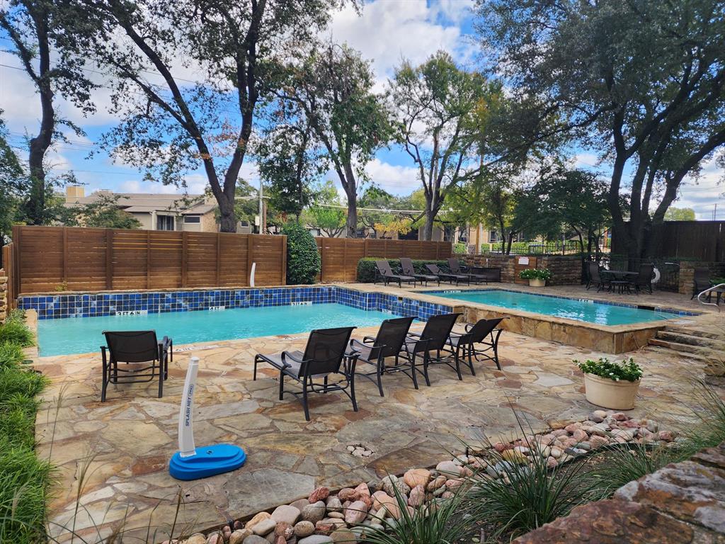 14151 Montfort Drive, Unit 345 Dallas, TX 75254 - Photo 28 of 31 a view of a backyard with sitting area