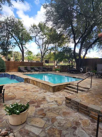 a view of a backyard with sitting area