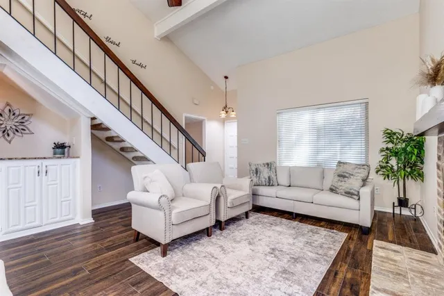 a living room with furniture and a rug