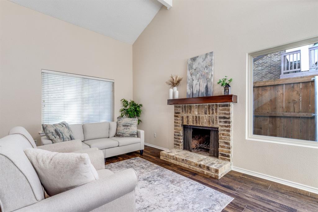 14151 Montfort Drive, Unit 345 Dallas, TX 75254 - Photo 5 of 31 a living room with furniture a fireplace and window