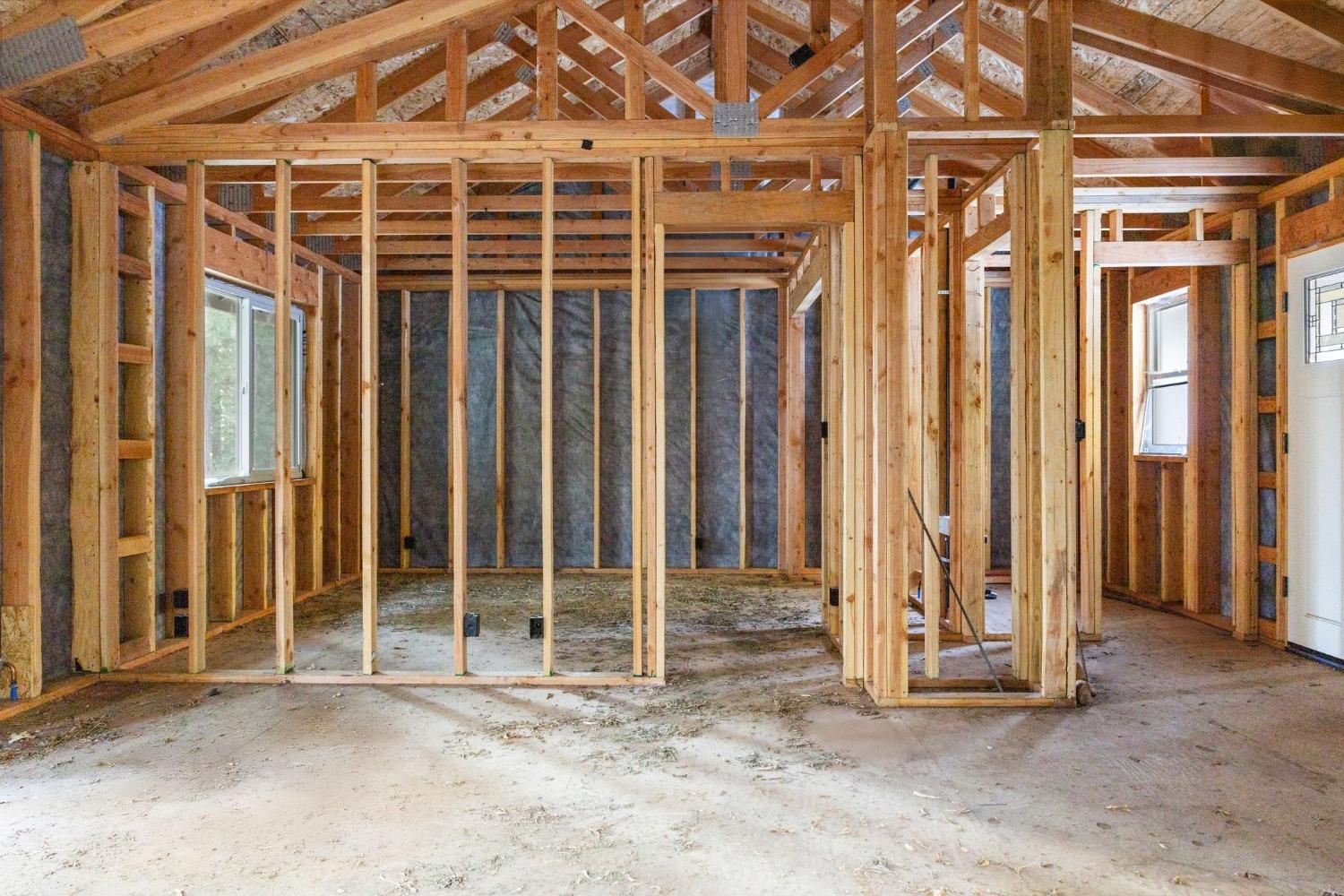 16277 Ophir Silver Road Nevada City, CA 95959 - Photo 14 of 51 an empty room with wooden floor and windows