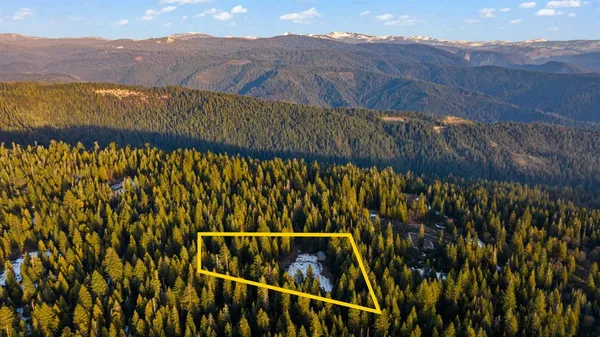 a aerial view of a house with a yard