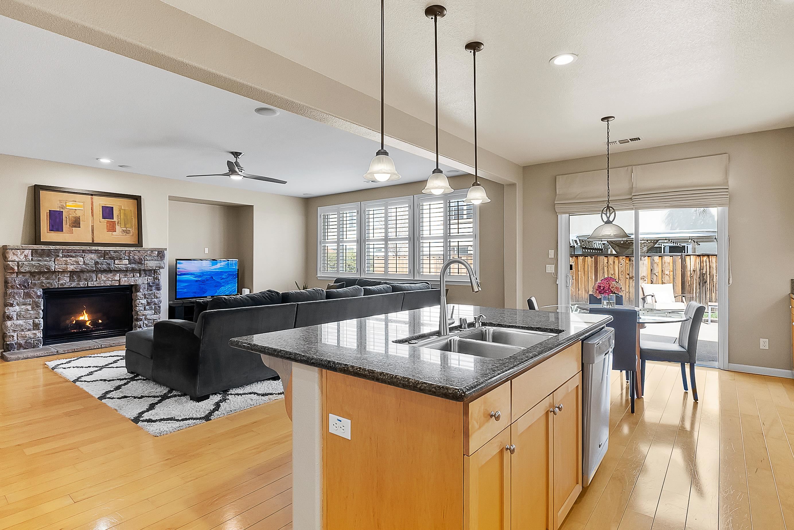 5282 Fern Ridge Circle Discovery Bay, CA 94505 - Photo 11 of 41 a kitchen with kitchen island a dining table and chairs