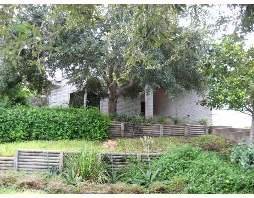 a view of house with a yard