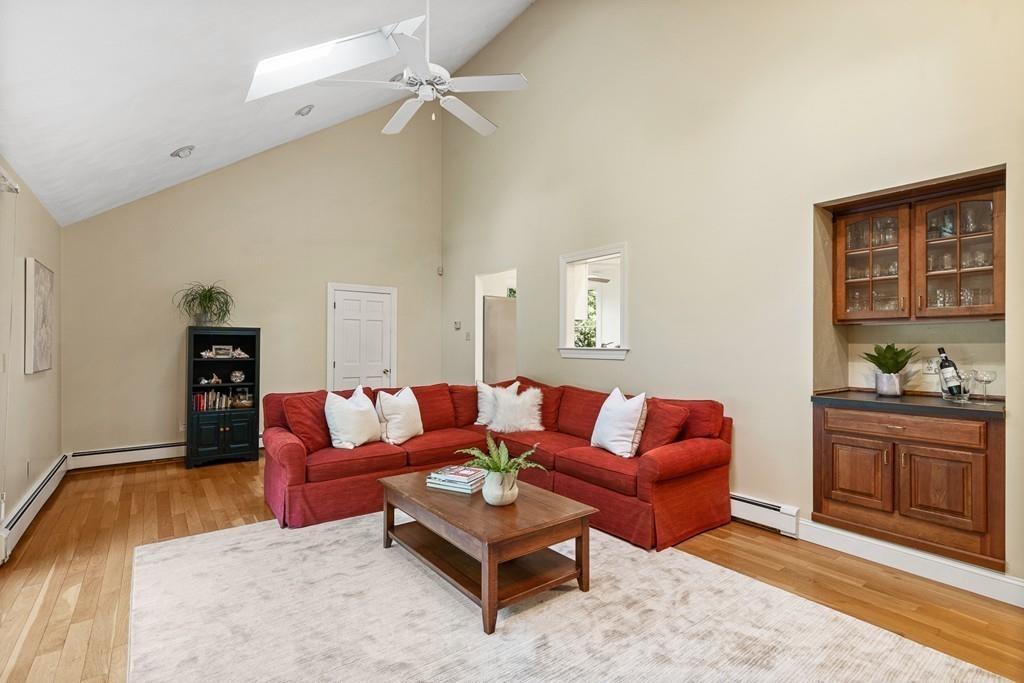 9 Deepwoods Drive Natick, MA 01760 - Photo 13 of 31 a living room with furniture and a rug