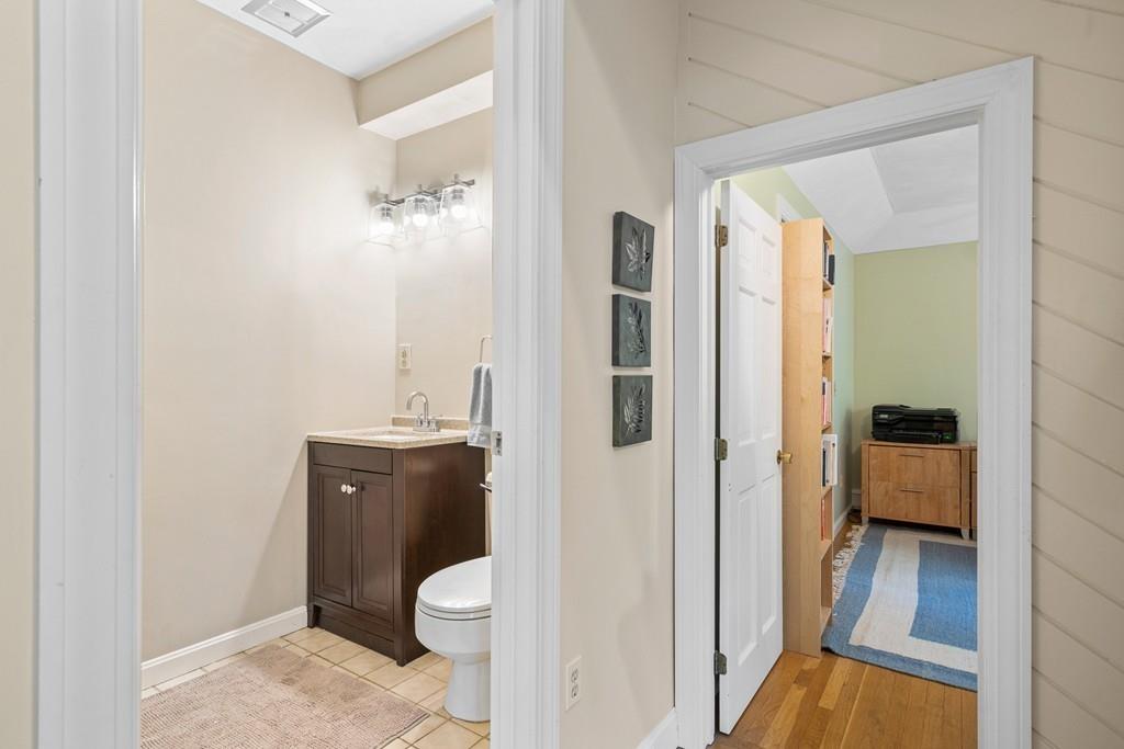 9 Deepwoods Drive Natick, MA 01760 - Photo 14 of 31 a bathroom with a sink and toilet