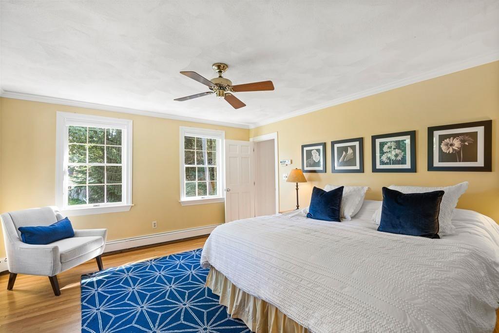 9 Deepwoods Drive Natick, MA 01760 - Photo 17 of 31 a bedroom with a large bed and a window