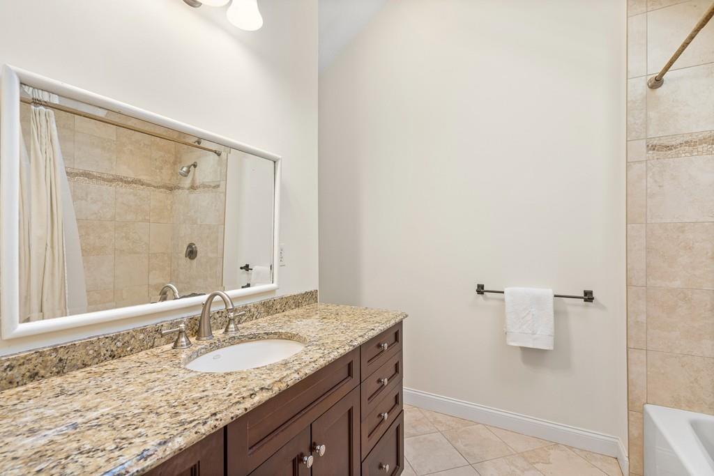9 Deepwoods Drive Natick, MA 01760 - Photo 18 of 31 a bathroom with a granite countertop sink and a mirror