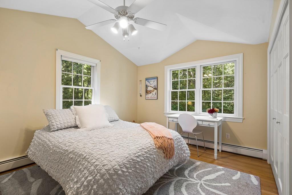 9 Deepwoods Drive Natick, MA 01760 - Photo 19 of 31 a bedroom with a large bed and windows