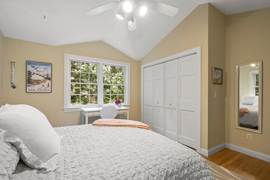 9 Deepwoods Drive Natick, MA 01760 - Photo 20 of 31 a spacious bedroom with a bed and a window