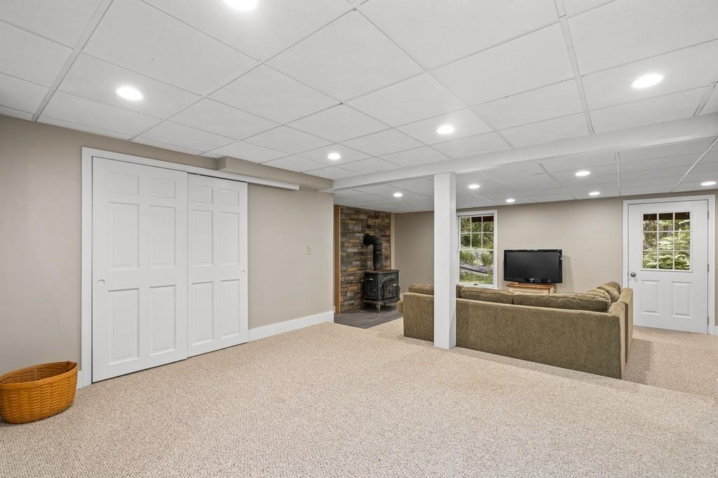 9 Deepwoods Drive Natick, MA 01760 - Photo 23 of 31 a view of a livingroom with a flat screen tv