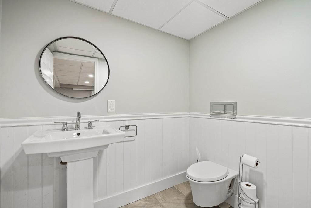 9 Deepwoods Drive Natick, MA 01760 - Photo 26 of 31 a bathroom with a sink mirror and toilet