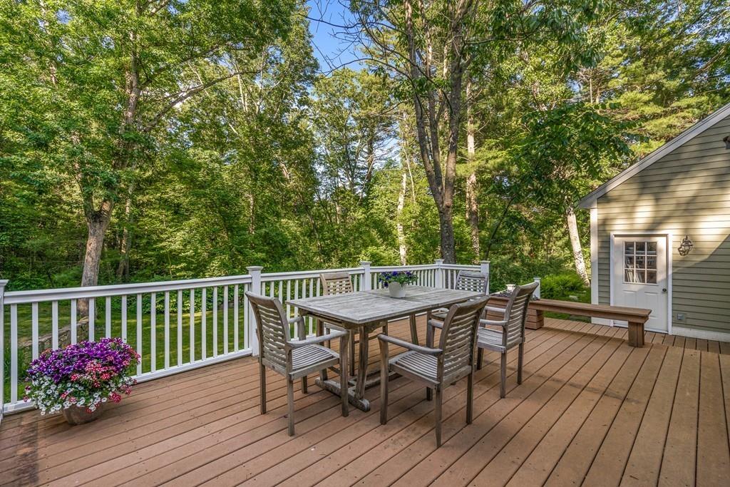 9 Deepwoods Drive Natick, MA 01760 - Photo 28 of 31 a view of a deck with furniture and wooden floor