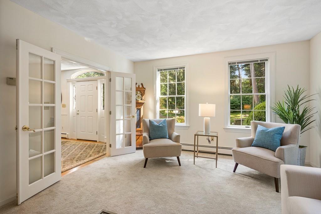 9 Deepwoods Drive Natick, MA 01760 - Photo 5 of 31 a living room with furniture and a large window